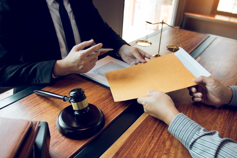 lawyer handing over folder with documents