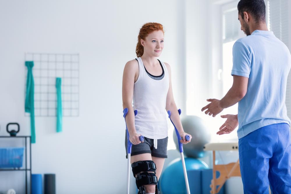 woman with crutches during rehabilitation