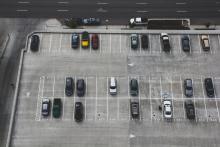 Overview of Parking Lot with Cars Parked in Some Spots